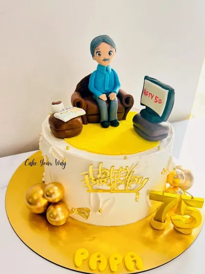 A customized cake for Papa's 75th birthday, showing him relaxing and watching the stock market.