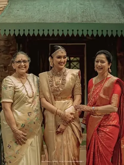 A precious moment between three generations. The bride sharing a smile with her mother and grandmother is a beautiful story of family and love.
