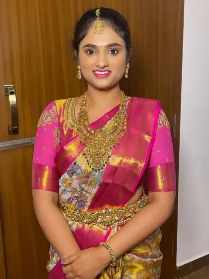 A smiling portrait of the bride, looking radiant and ready for her big day.