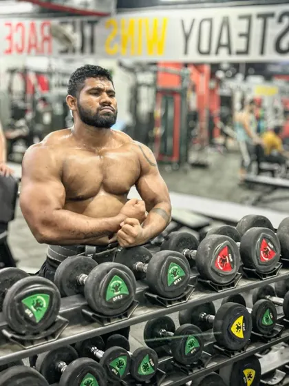 Eat, sleep, gym, repeat. A front pose showing the 2kg of muscle mass I've recently gained.