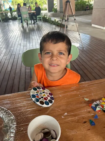 This little boy is so proud of the mosaic coaster he created at our stall at RMZ Ecoworld.