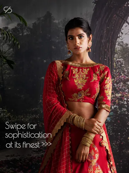 A closer look at the fine craftsmanship of this red bridal lehenga, showing the sophistication of the boat-neck blouse and the detailed embroidery that makes it a statement piece.