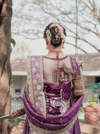Another angle of the stunning back details of the blouse and hairstyle.