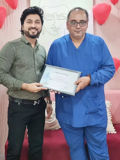 Receiving a certificate of training within my clinic. I believe that success comes from creating value, and for me, that means continuously honing my skills in cosmetic and hair transplant surgery.