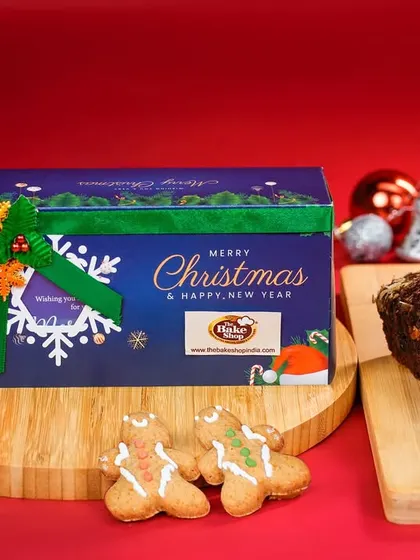 Another view of our festive gift tin, perfect for corporate or personal gifting. The tin keeps the plum cake and gingerbread cookies fresh and makes for a wonderful keepsake.