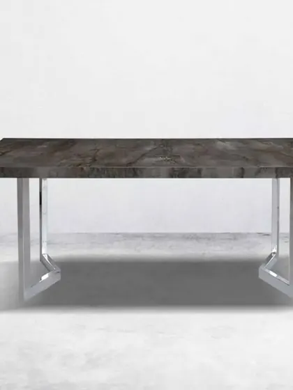 This dining table features a dark grey marble-finish top with a polished chrome base, offering a sleek and industrial-chic aesthetic.