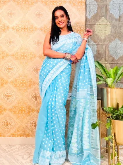 This blue polka dot Jamdani saree from Meesho is a beautiful and affordable find. The fabric is a soft cotton-silk blend, perfect for any casual occasion.