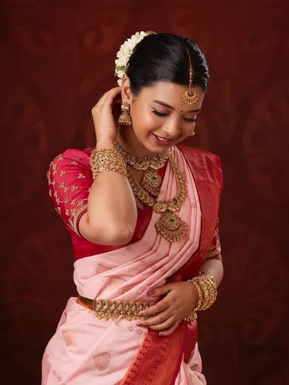 The complete look, showing how the jewellery enhances the bride's elegance.