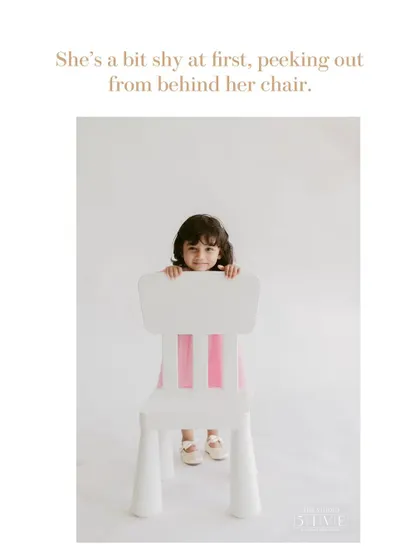 This is how many of our kids' portrait sessions begin, with a little shyness. We give them space and time, letting them peek out from behind a chair until they are comfortable.