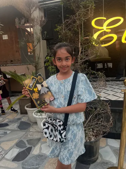 A very stylish student with her equally stylish diary, featuring a beautiful bow and floral design.