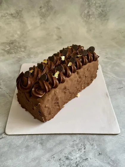 My Marble Cake is the best of both worlds, blending chocolate and vanilla sponge. It's coated in a gourmet glaze and finished with chocolate ganache and gold leaf.