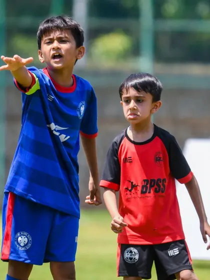 Shlook Gamre leading his team on the field. We develop not just players, but leaders.