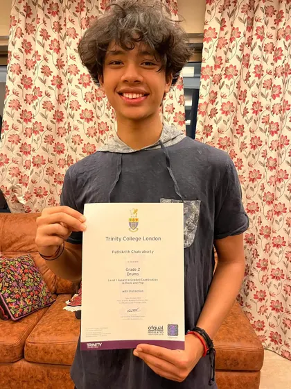 Another proud moment. This student proudly holds his Grade 2 certificate with distinction. We celebrate every milestone with our students.