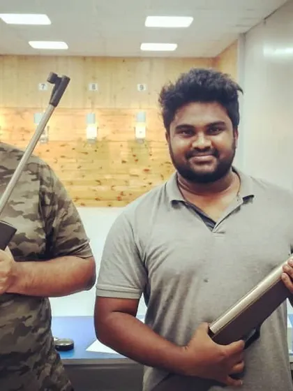 Two friends pose with their sports-grade air rifles inside our 10-meter range. Our walk in guest shooting sessions are perfect for a spontaneous and fun afternoon.