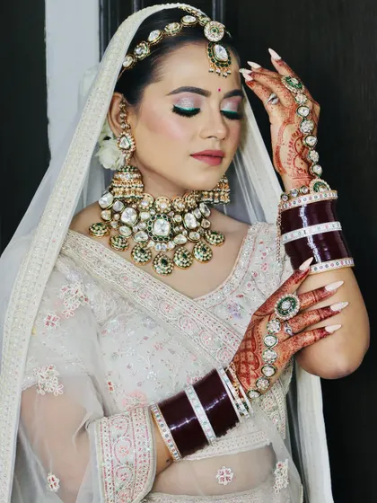 Another angle of this stunning bride, showing how the makeup, hair, and jewelry come together.