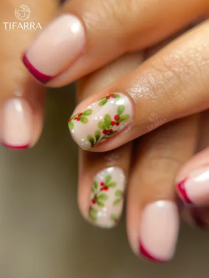 A close-up of the hand-painted holly, showing the delicate brushstrokes and details on this festive set.