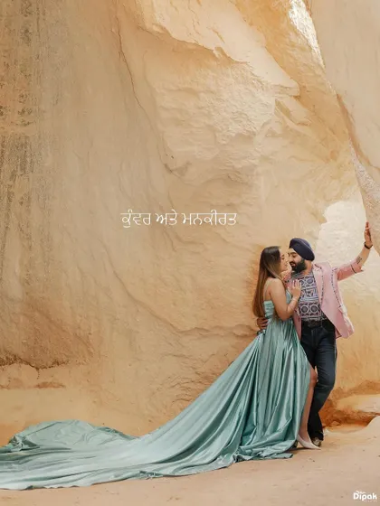 A romantic embrace within the unique rock formations of Turkey. The bride's flowing teal gown adds a touch of cinematic drama to the natural landscape, a signature of my destination photography.
