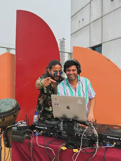 A shot from an event in Kolkata. This photo captures the partnership between me at the DJ console and Dino on percussion, ready to bring our combined energy to the stage.