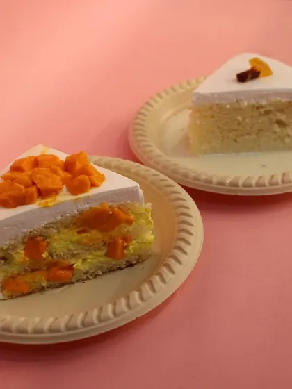 Two of our fruit pastries side-by-side: the Mango Pastry in the foreground and the Milk Pastry in the background.