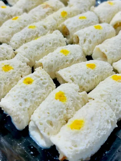 A full tray of my Chena Rolls, ready to be served. The delicate texture and subtle sweetness make it a sophisticated and beloved dessert.