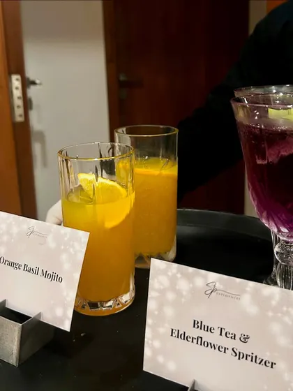 Refreshing mocktails like this Orange Basil Mojito and Blue Tea & Elderflower Spritzer set the mood for a fun-filled evening.