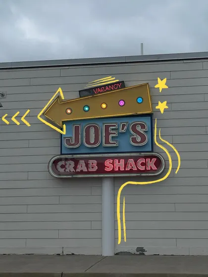 A cool retro sign for Joe's Crab Shack, with some neon-style doodles to match.