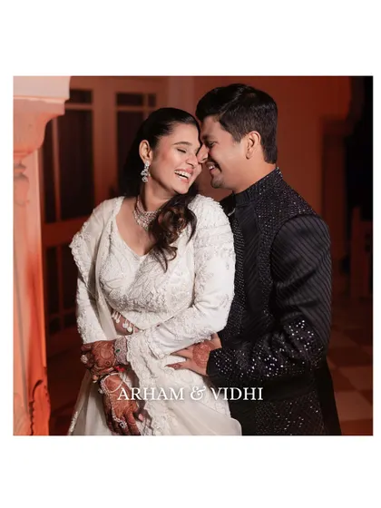 A joyful, candid moment of the couple laughing together during their Sangeet. This shot perfectly captures their easy chemistry and happiness.