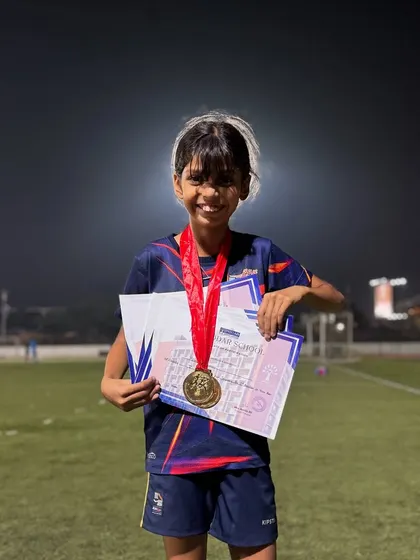 Kiana Sharma beaming with pride as she holds her two Gold medals and certificates. A fantastic result from a dedicated young athlete.