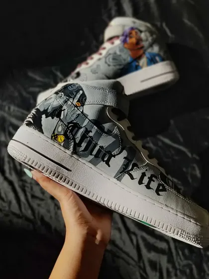 A side view of the Tupac custom, showing the "Thug Life" lettering. The grey and black color scheme gives it a gritty, vintage feel.