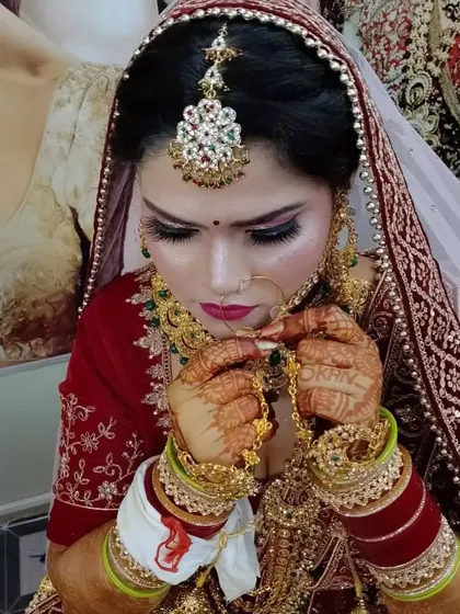 A candid moment of a bride on her wedding day. The makeup is set to be transfer-proof and long-lasting, ensuring she looks perfect from every angle, all day long.