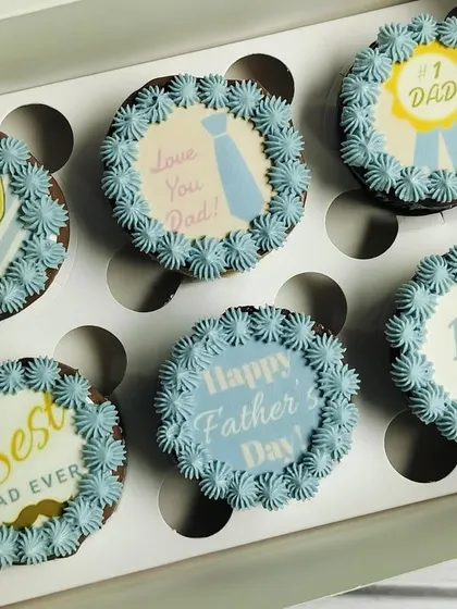 The full set of my blue-themed Father's Day cupcakes. The designs include "Best Dad Ever," "#1 Dad," and "I Love Dad," offering a variety of loving messages.