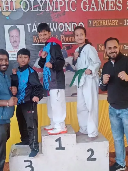 A proud group photo with our sub-junior medalists at the Delhi Olympic Games. We are there to cheer for our students at every event.