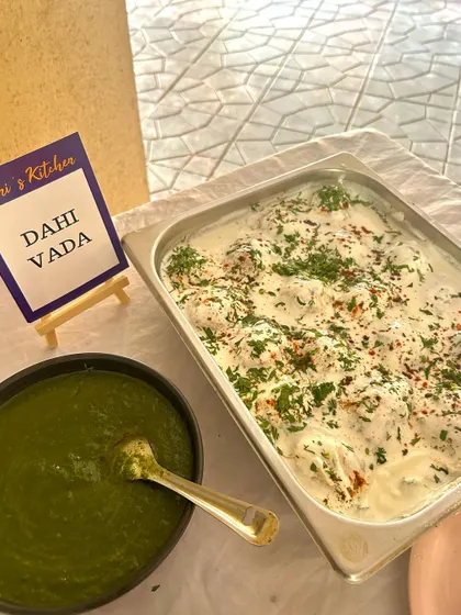 A tray of delicious Dahi Vada, freshly prepared and garnished, ready to be added to the buffet line for a Republic Day brunch.