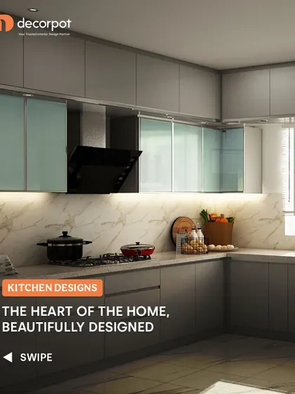 This L-shaped kitchen uses a muted grey for the cabinets, paired with frosted glass on the upper units. The design creates a calm and sophisticated atmosphere, perfect for a modern home.