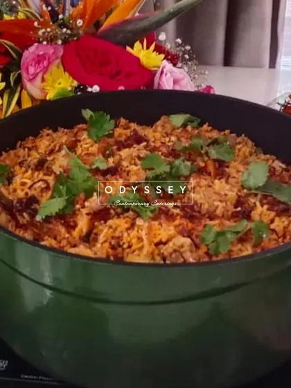 A large pot of our flavorful biryani, ready to be served. We cater for large gatherings, ensuring that our main courses are just as delicious and well-presented as our appetizers.