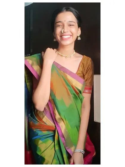 A joyful moment captured during a festive occasion. This traditional Maharashtrian look, complete with a nose ring (nath), is something I often wear for cultural programs to honor my roots.