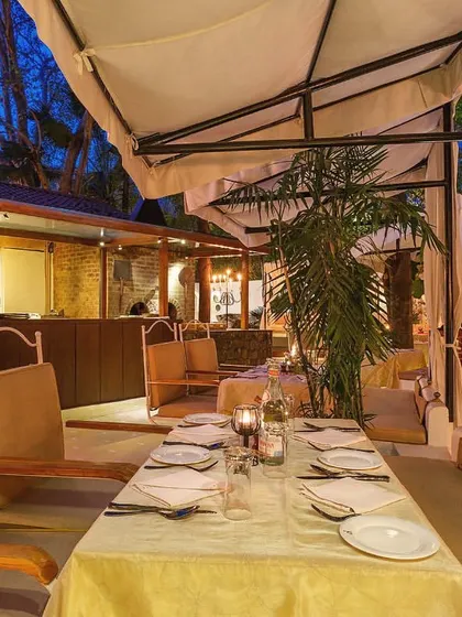 Our alfresco dining area offers a beautiful escape within the city. The combination of natural surroundings and elegant design makes for a truly relaxing experience.