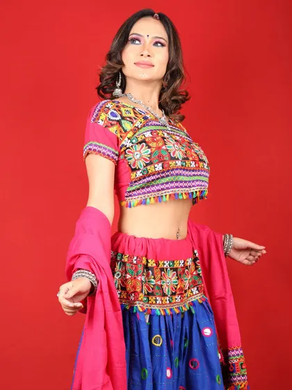 A full-length view of this colorful Navratri outfit and makeup. The look is perfect for celebrating with dance and music.