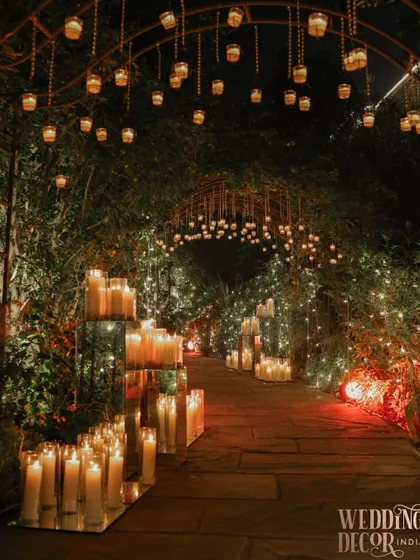 Imagine walking towards your future through a pathway of pure magic. We created this enchanting aisle using hundreds of candles and hanging lanterns, crafting an ethereal glow that feels both intimate and incredibly grand.