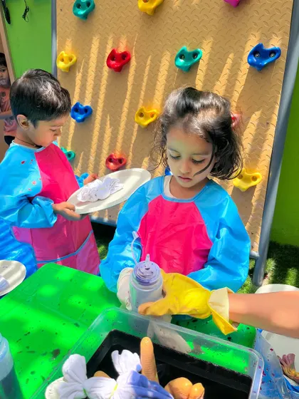 Each activity, from making Bhel Puri and toast to plucking methi leaves and exploring what floats, is a lesson in itself. These practical life and sensorial activities are central to the Montessori method, helping children develop fine motor skills, concentration, and a deep understanding of the world through their own actions.