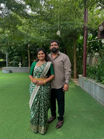 Me and my husband. I'm wearing one of my own designs, a simple yet elegant green blouse to go with my Banarasi silk saree.