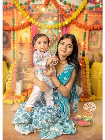 A beautiful portrait of a mother and her son celebrating their first Diwali together. These are the moments that become treasured family heirlooms.