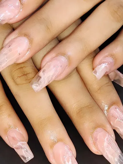 Another view of the long, clear acrylic marble nails.