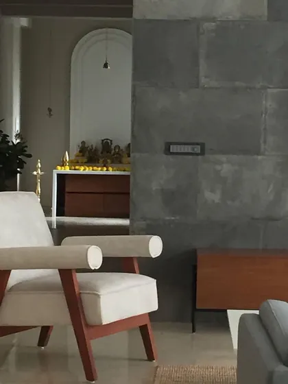 A glimpse from the living area into the serene mandir space. This view highlights how we integrate distinct functional zones while maintaining a cohesive visual flow throughout the home.