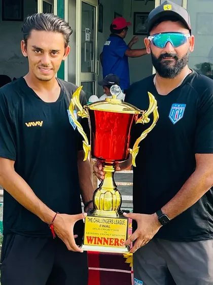 Another trophy in the cabinet. Holding the Challengers League final trophy with one of my senior players.