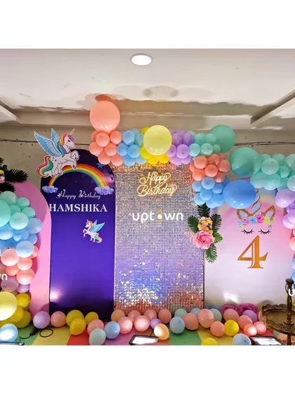 Another view of the unicorn party with a 'Happy Birthday' sequin panel.
