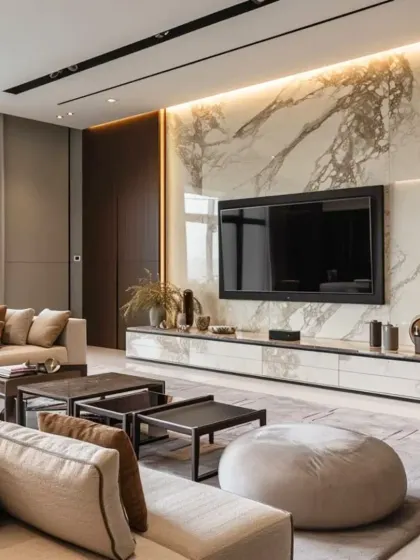 A stunning living room where the TV wall is the hero. I used a large slab of book-matched marble as the backdrop for the television, creating a powerful and luxurious statement piece.