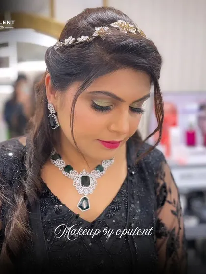 Every masterpiece deserves a touch of luxury. This elegant updo with a beautiful hair accessory is perfect for a bride or any formal event, showcasing true artistry.
