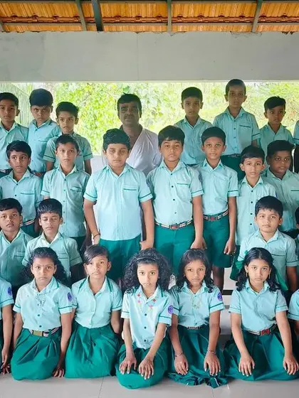 A group photo of my students at Theyyangad school. We instill discipline and teamwork from a young age.