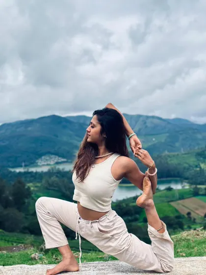 Practicing Eka Pada Rajakapotasana, or One-Legged King Pigeon Pose, surrounded by nature. For me, yoga is not just about the pose but about finding balance and stillness wherever you are.